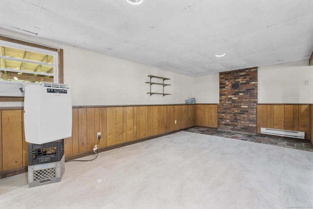 83 Julia Ter, Middletown, CT 06457 - below grade area with a baseboard heating unit, wainscoting, and wooden walls