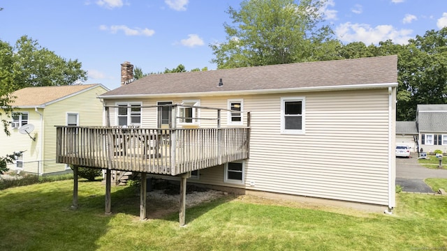 83 Julia Ter, Middletown, CT 06457 - rear view of property featuring a wooden deck, a yard, and a chimney