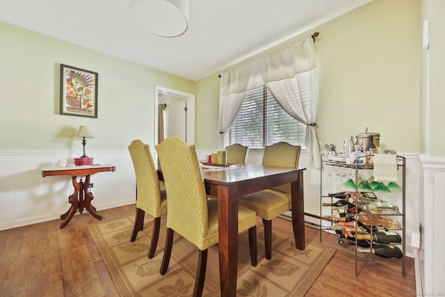 718 Cove Rd Apt 3, Stamford, CT 06902 - dining space with wainscoting and wood finished floors