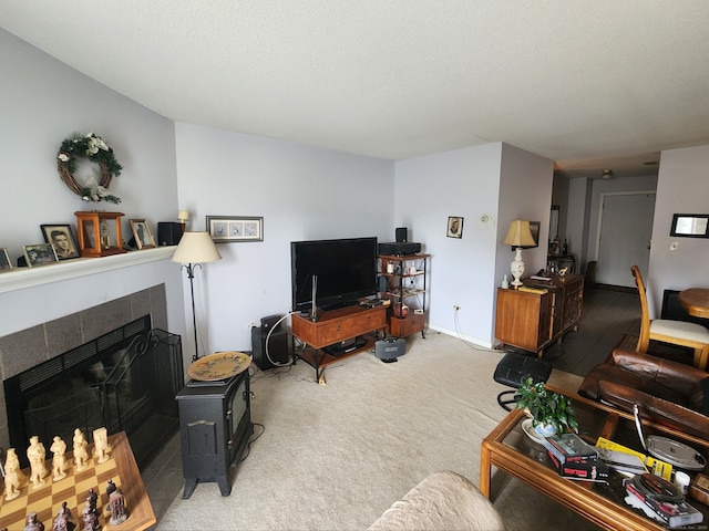 2390 State St Apt 7D, Hamden, CT 06517 - carpeted living room featuring a tile fireplace