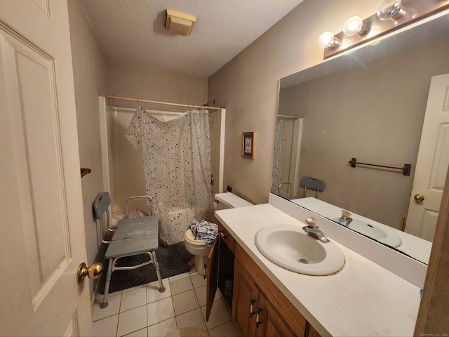 2390 State St Apt 7D, Hamden, CT 06517 - bathroom featuring vanity, tile patterned flooring, a textured ceiling, and shower / tub combo with curtain