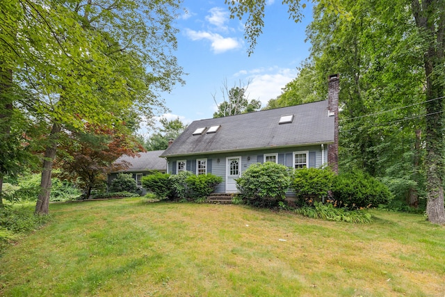 70 Brighton Rd, Hebron, CT 06248 - back of house featuring a lawn and a chimney