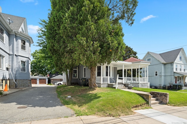 163 Willetts Ave, New London, CT 06320 - view of front of property with a porch, an outdoor structure, a front lawn, and a garage