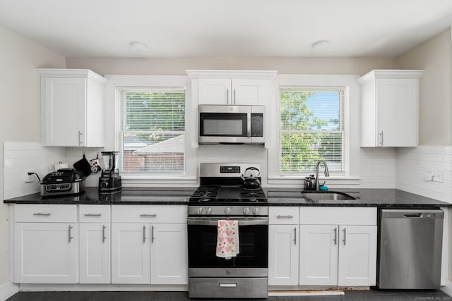 163 Willetts Ave, New London, CT 06320 - kitchen with appliances with stainless steel finishes, white cabinets, and tasteful backsplash