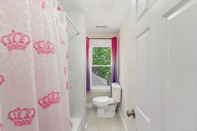 163 Willetts Ave, New London, CT 06320 - bathroom with toilet and shower / bath combo with shower curtain