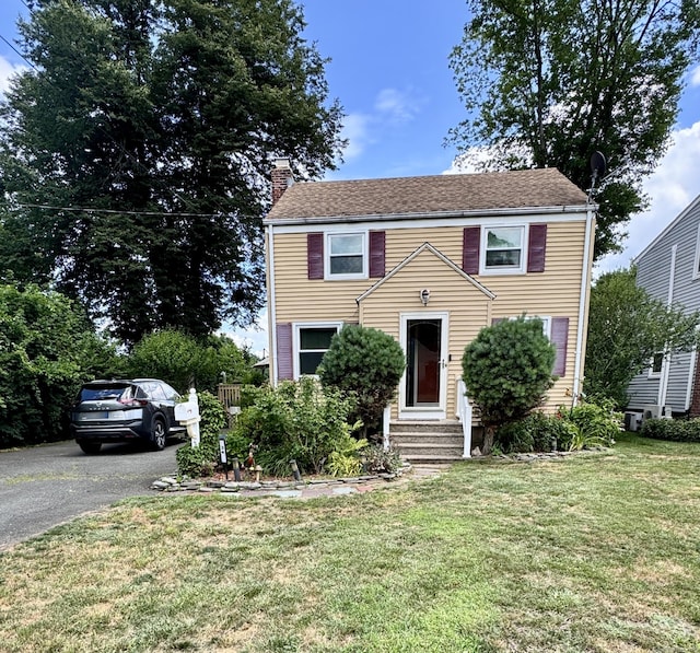 34 Federal St, West Hartford, CT 06110 - view of front of property with entry steps, a chimney, a front lawn, and driveway