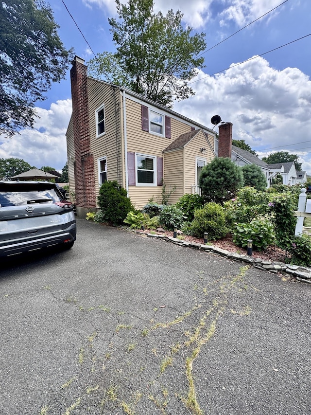 34 Federal St, West Hartford, CT 06110 - view of front facade featuring a chimney