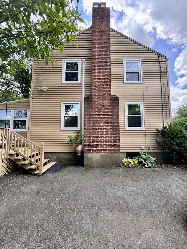34 Federal St, West Hartford, CT 06110 - view of property exterior with a chimney and stairs