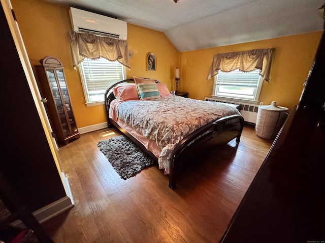 34 Federal St, West Hartford, CT 06110 - bedroom with a wall mounted air conditioner, lofted ceiling, wood-type flooring, and radiator