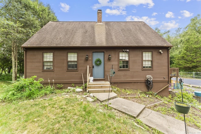 64 Iron St, Ledyard, CT 06339 - view of front of house with a chimney and roof with shingles