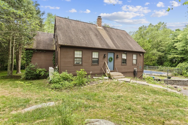 64 Iron St, Ledyard, CT 06339 - view of front of house featuring a chimney and roof with shingles