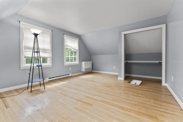 64 Iron St, Ledyard, CT 06339 - additional living space with baseboard heating, lofted ceiling, and wood finished floors