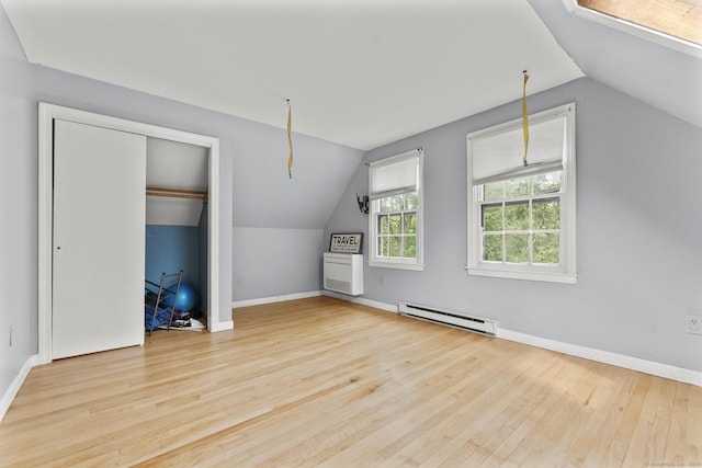 64 Iron St, Ledyard, CT 06339 - bonus room featuring a baseboard radiator, lofted ceiling, and wood finished floors