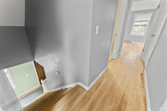 64 Iron St, Ledyard, CT 06339 - hall with light wood finished floors and a baseboard heating unit