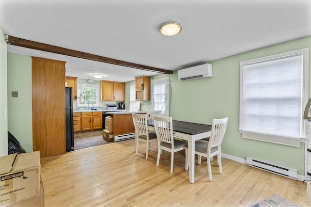 64 Iron St, Ledyard, CT 06339 - dining space with a baseboard radiator, an AC wall unit, light wood-type flooring, and beam ceiling