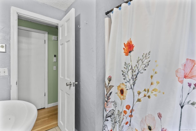 64 Iron St, Ledyard, CT 06339 - bathroom featuring wood finished floors and a shower with shower curtain