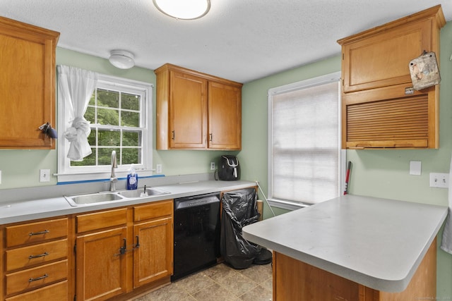 64 Iron St, Ledyard, CT 06339 - kitchen with dishwasher, light countertops, a peninsula, a textured ceiling, and brown cabinetry