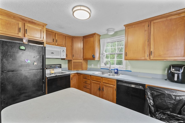 64 Iron St, Ledyard, CT 06339 - kitchen with black appliances, light countertops, and brown cabinets