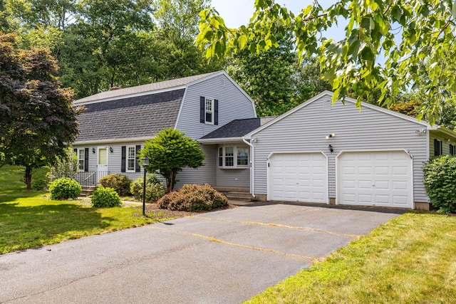 10 Empire Way, Bristol, CT 06010 - colonial inspired home featuring a garage, driveway, roof with shingles, a front yard, and a gambrel roof