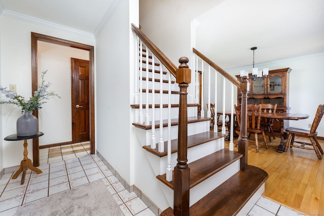 10 Empire Way, Bristol, CT 06010 - stairs with ornamental molding, a chandelier, and tile patterned flooring