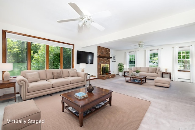 10 Empire Way, Bristol, CT 06010 - carpeted living room featuring ceiling fan, a baseboard heating unit, and a brick fireplace