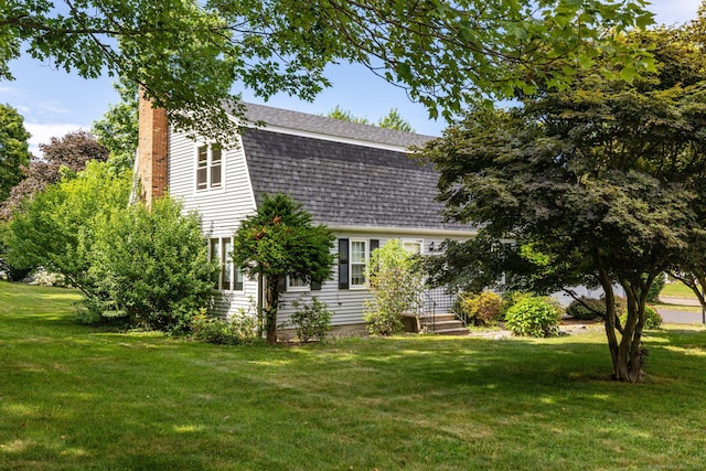 10 Empire Way, Bristol, CT 06010 - back of property with a gambrel roof, a yard, a chimney, and a shingled roof