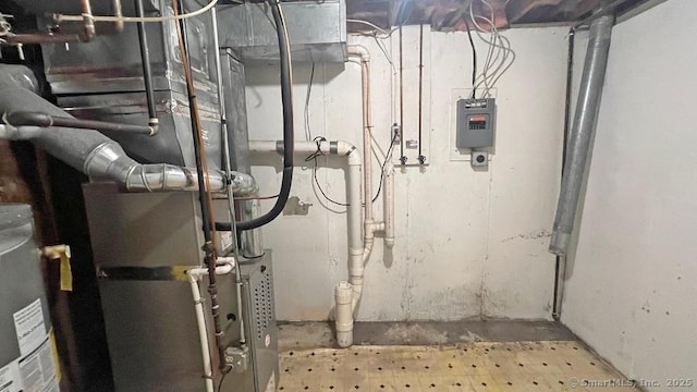 utility room featuring heating unit
