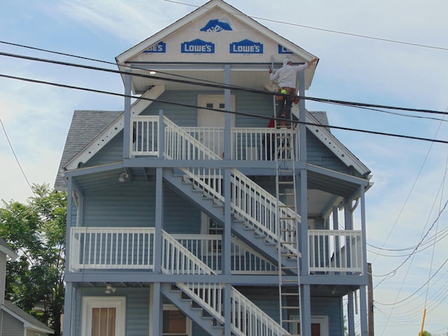 69 W Liberty St, Waterbury, CT 06706 - view of front facade featuring stairs and roof with shingles