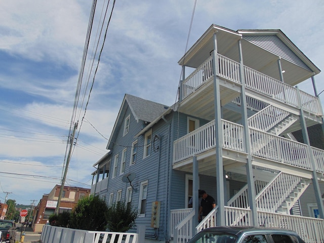 69 W Liberty St, Waterbury, CT 06706 - view of side of property featuring a balcony and stairway