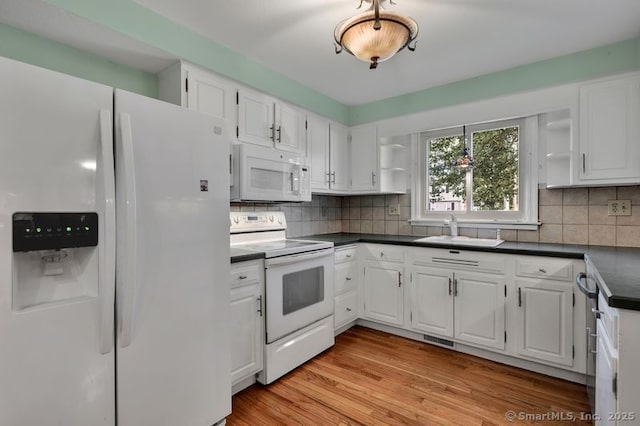 151 Timber Trl, East Hartford, CT 06118 - kitchen with white appliances, open shelves, dark countertops, and white cabinetry