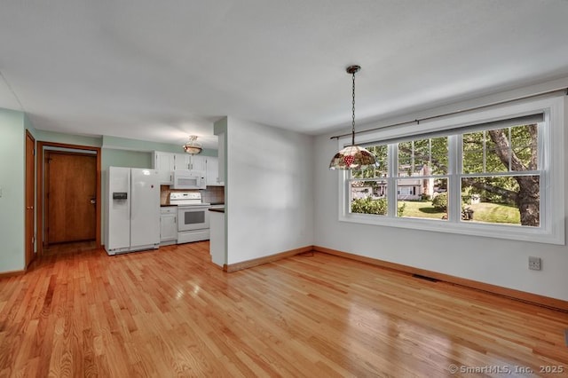 151 Timber Trl, East Hartford, CT 06118 - unfurnished living room with light wood-type flooring and baseboards