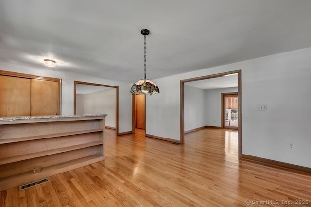 151 Timber Trl, East Hartford, CT 06118 - unfurnished dining area featuring light wood-style flooring and baseboards