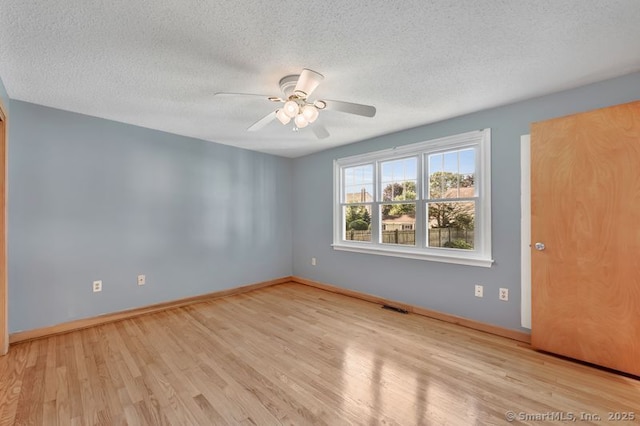 151 Timber Trl, East Hartford, CT 06118 - empty room featuring wood finished floors, a textured ceiling, and ceiling fan