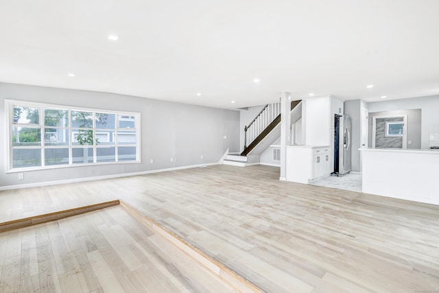 34 2nd Ave, East Haven, CT 06512 - unfurnished living room featuring light wood-type flooring, recessed lighting, and stairs