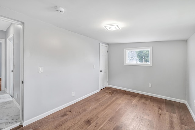 34 2nd Ave, East Haven, CT 06512 - unfurnished room featuring a smoke detector and wood finished floors