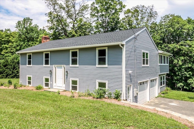 36 Jotham Rd, New Milford, CT 06776 - split foyer home with asphalt driveway, a front yard, a chimney, and an attached garage