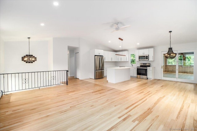 36 Jotham Rd, New Milford, CT 06776 - unfurnished living room with a ceiling fan, light wood-style flooring, lofted ceiling, a chandelier, and recessed lighting