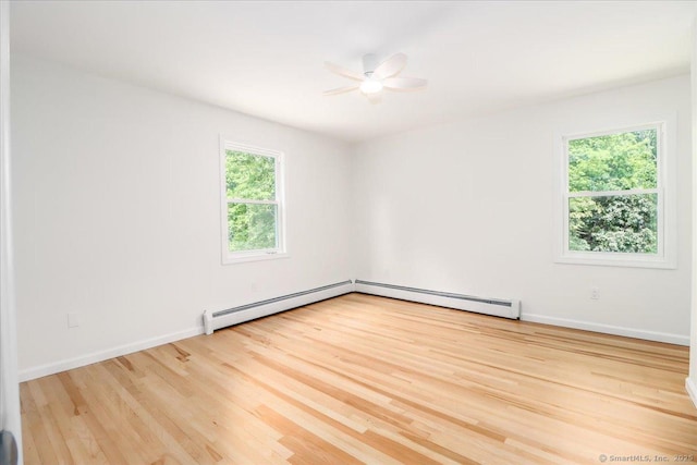 36 Jotham Rd, New Milford, CT 06776 - empty room with plenty of natural light, a baseboard heating unit, and wood finished floors