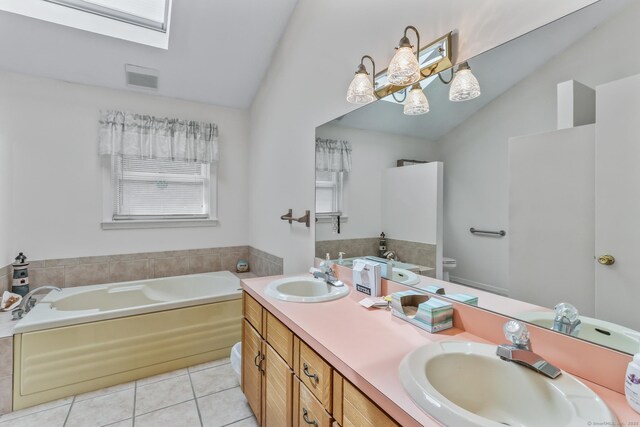 55 Grickis Ln, Naugatuck, CT 06770 - full bath with lofted ceiling, a garden tub, double vanity, tile patterned floors, and a skylight