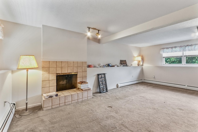 55 Grickis Ln, Naugatuck, CT 06770 - unfurnished living room featuring a baseboard heating unit, carpet, rail lighting, and a tiled fireplace