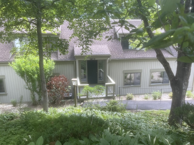 277 Heritage Vlg Unit C, Southbury, CT 06488 - view of front of home with a shingled roof and board and batten siding