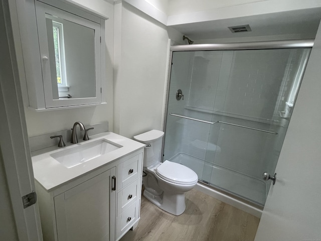 277 Heritage Vlg Unit C, Southbury, CT 06488 - bathroom featuring wood finished floors, vanity, and a shower stall
