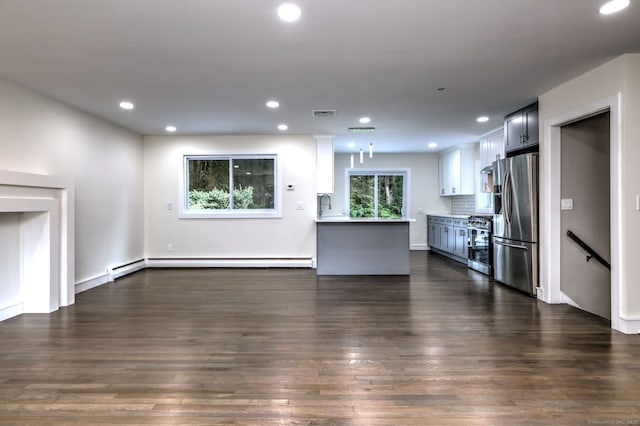 13 School St, Monroe, CT 06468 - unfurnished living room with a baseboard heating unit, dark wood finished floors, and recessed lighting