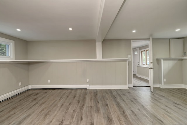 13 School St, Monroe, CT 06468 - below grade area featuring wood finished floors, recessed lighting, and a baseboard heating unit