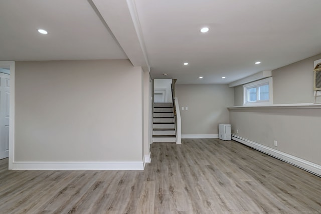13 School St, Monroe, CT 06468 - below grade area with wood finished floors, stairway, recessed lighting, and baseboard heating