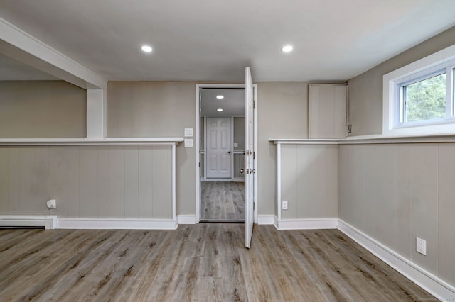 13 School St, Monroe, CT 06468 - empty room with a baseboard radiator, wood finished floors, recessed lighting, and wainscoting