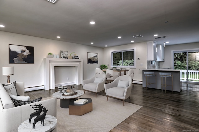 13 School St, Monroe, CT 06468 - living room with a baseboard heating unit, dark wood-style floors, recessed lighting, and a baseboard radiator