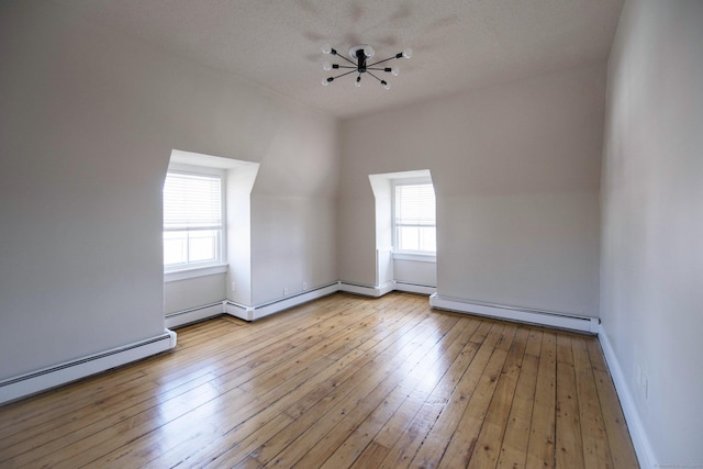 214 Broadway, Norwich, CT 06360 - additional living space featuring a baseboard heating unit, baseboard heating, and hardwood / wood-style floors