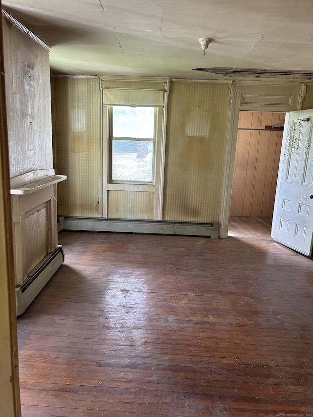 36 Boswell Ave, Norwich, CT 06360 - unfurnished living room with hardwood / wood-style flooring and a baseboard heating unit