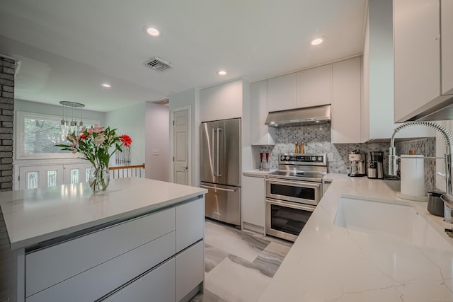 4 Northrop Rd, Woodbridge, CT 06525 - kitchen featuring stainless steel appliances, exhaust hood, white cabinets, backsplash, and recessed lighting